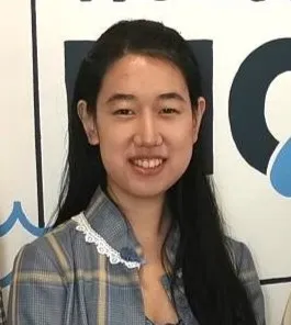 Portrait image of economics student smiling at the camera.