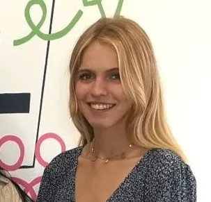 Portrait image of economics student smiling at the camera.