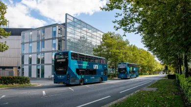 Unilink buses driving down University Road, Highfield Campus. 