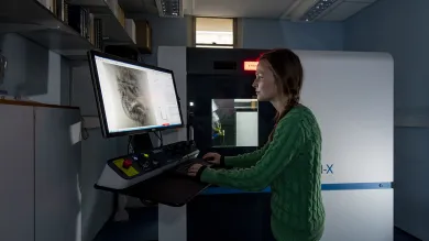A student examines an X ray in the biological imaging unit