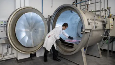 A student at work in the testing and structures research lab