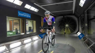 Cyclist takes part in an aerodynamics experiment in the R J Mitchell wind tunnel