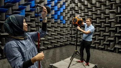 Two students using the large anechoic chamber