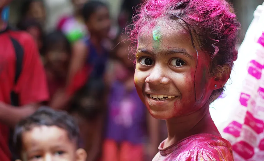 Selective focus photo of girl in shirt smiling