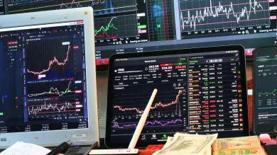 Stock markets index displaying on computer screens 