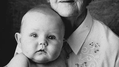 An old woman with a baby on her arms