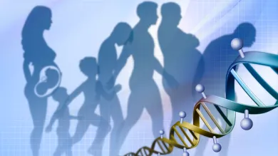 In the foreground a strand of DNA spirals into the distance diagonally across the bottom of the image. In the background the stages of a persons life, from unborn baby to old age, are depicted by overlapping silhouettes.