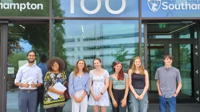 The public contributors who attended the Faculty of Medicine Research Conference in 2023. They all look pleased to be at the conference. They are standing outside the University's new Centenary Building, numbered 100. It is a bright and clear day.