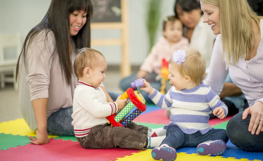 Parents playing with their children