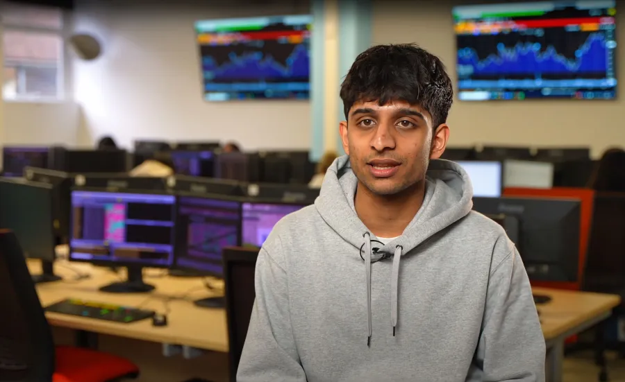 Vinay sitting in the Financial laboratory at Southampton