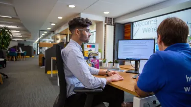 A student meets with a careers adviser for individual guidance in an on-campus careers space.