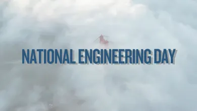 National Engineering Day text, in blue, over a suspension bridge in clouds