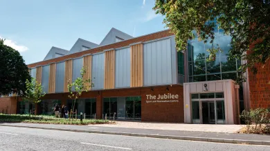 The outside view of the Jubilee Sports Centre on a sunny day.