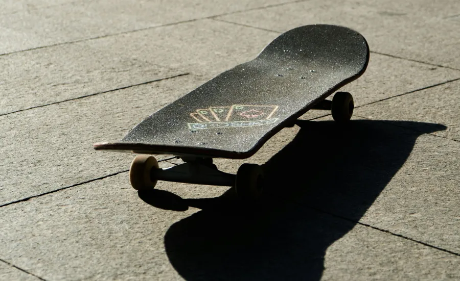 Skateboard on patio in sunshine