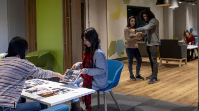 Students talking and relaxing in the Glen Eyre main building common room.