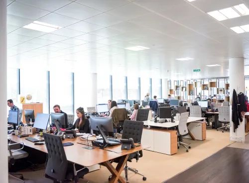 Image showing people working in a large office space.