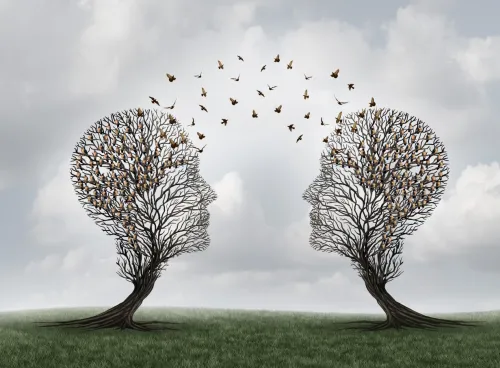 Two head shaped trees with birds flying to each other as a metaphor for teamwork 