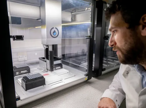 Scientist looking at lab equipment