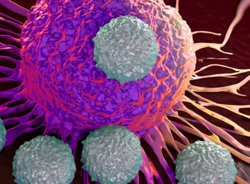3D illustration of a cancer cell with smaller round cells surrounding it.