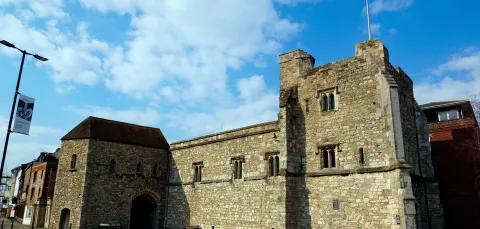 Outside view of the grey stone walls of God's Tower.