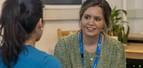 Adviser and student in conversation. 