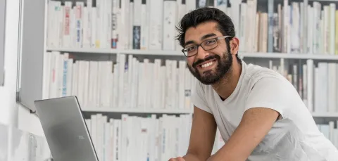 accelerated law degree student working on his laptop