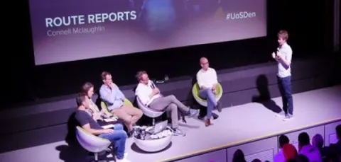 A student entrepreneur presents his business idea, Route Reports, to a panel of investors at the University's FutureWorlds Dragon's Den event.