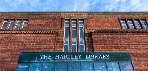 Frontage of the Hartley Library focusing on red brick detail and foyer windows