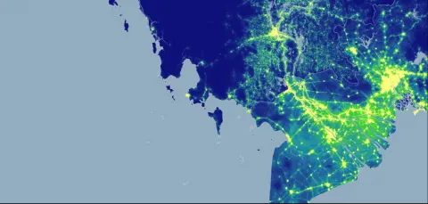 An aerial map coloured to show population distribution over a geographical area.