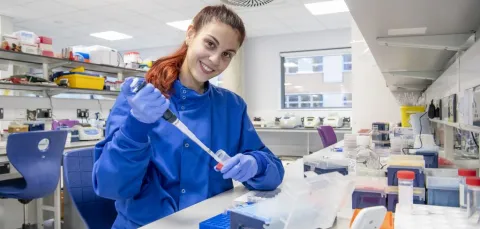 Michaela, a PhD student at the centre, conducting research in a laboratory.