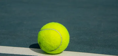 Tennis ball on tennis court