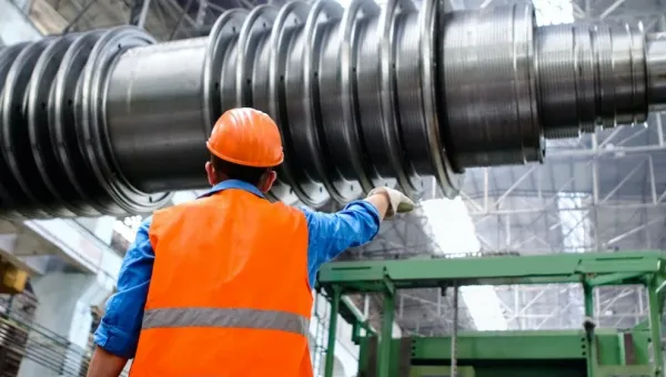 A technician in a high voltage components factory