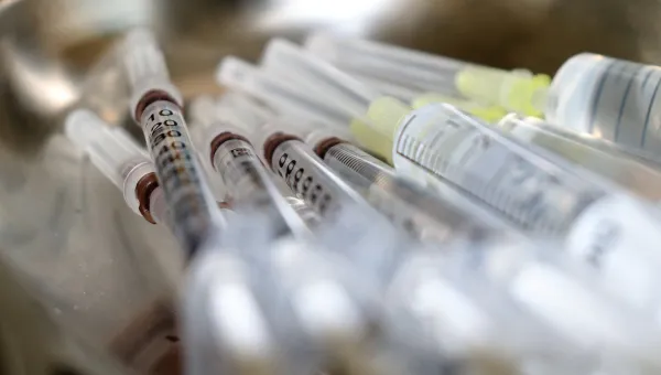 Blurred image of a selection of syring sample tubes 