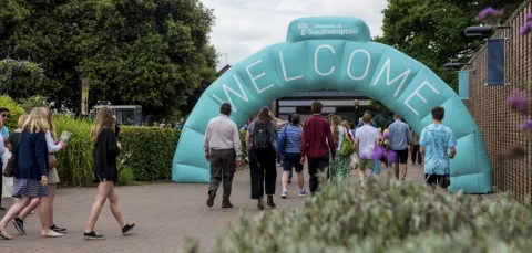 Visitors walking through the inflatable welcome arch on Highfield campus