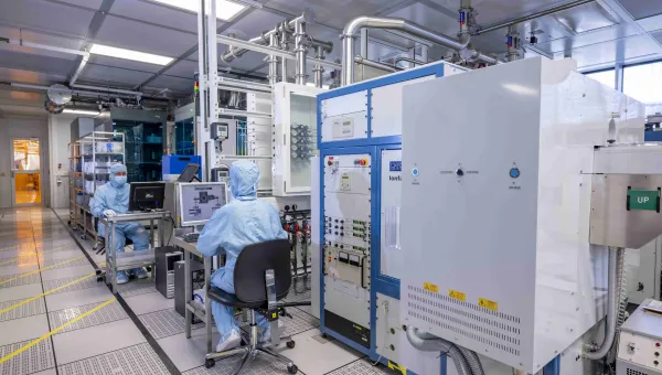 Researchers wearing cleanroom suits in the nanofabrication cleanrooms 
