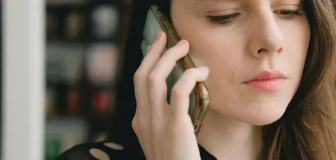 Young woman talking on her mobile phone