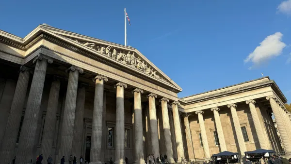 The front of the British Museum on a sunny day. 