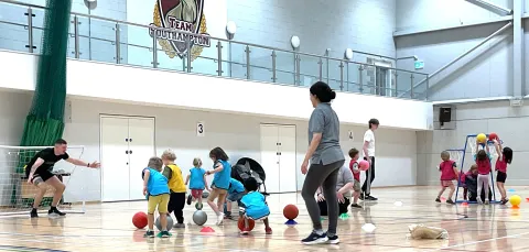 Children playing in a sports room