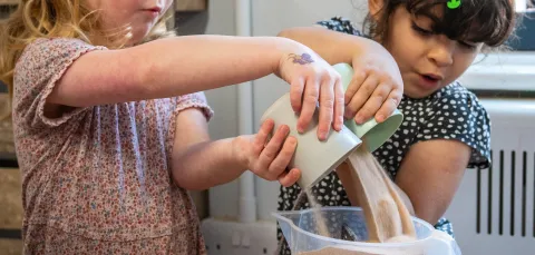 Early Years Centre children playing with sand