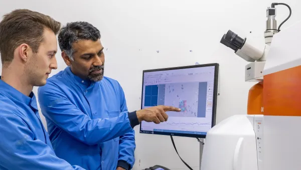 Professor Sumeet Mahajan and student at a computer