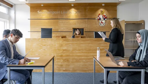 Law students practising in the Moot court room.