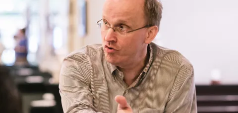 Professor Jon Grant talking and gesticulating