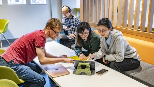 A group of postgraduate students taking part in an online event.