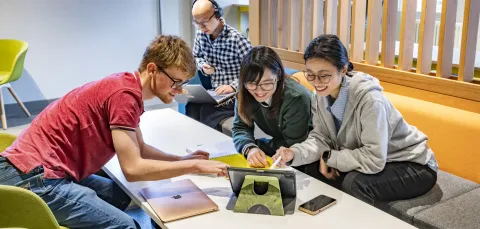 A group of postgraduate students taking part in an online event.