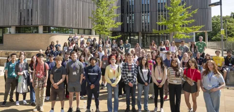 A group photo of all the Sutton trust summer school participants standing outside the Life Sciences building. 