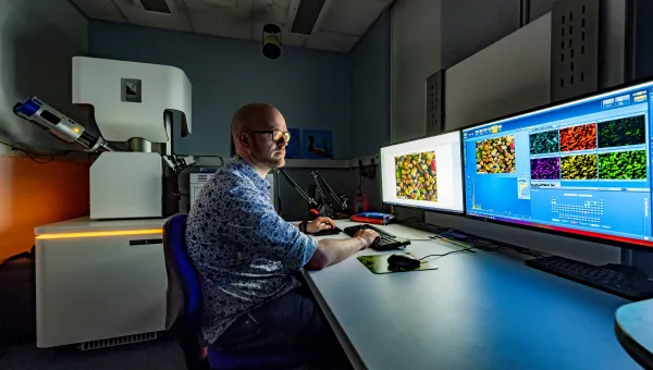 James Thompson working at a commuter processing images
