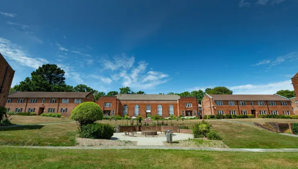 An exterior view of the Glen Eyre halls of residence at the University of Southampton, including a grassy courtyard area.