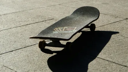 Skateboard on patio in sunshine
