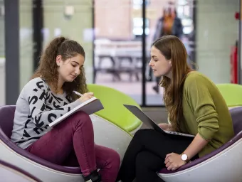 Student advisers in discussion in SUSU lobby.