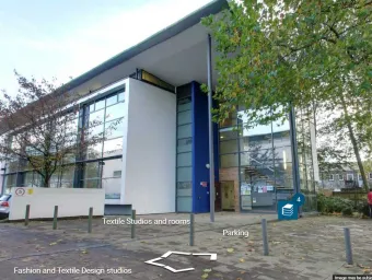 Exterior view of a large, modern concrete and glass building.